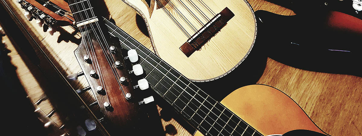 Group of Guitars and Used Musical Instruments