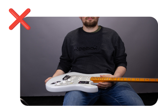 Guitar Held in Lap Improperly