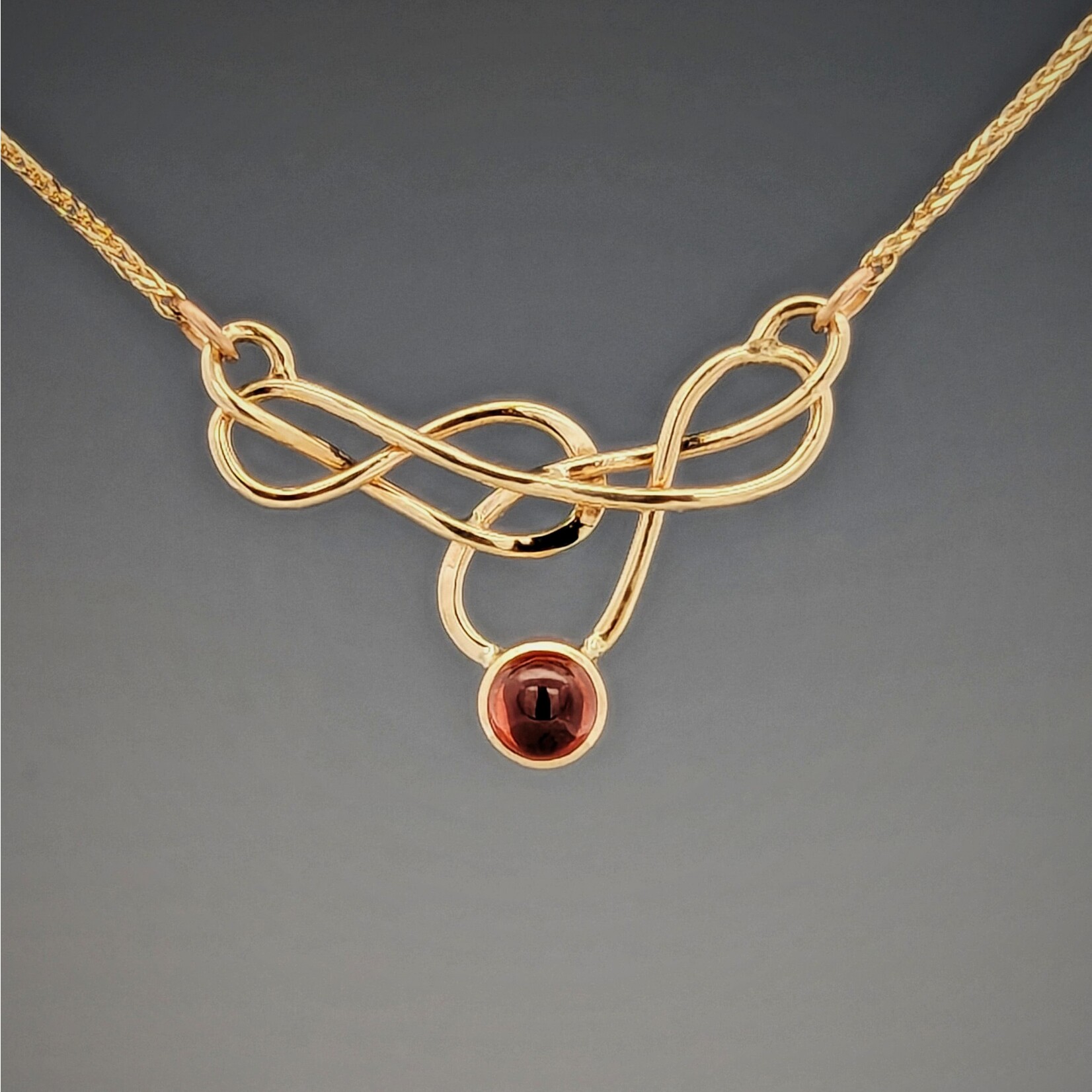 Modern Heirloom® Elegant Knot Necklace set with Garnet, 14k yellow gold