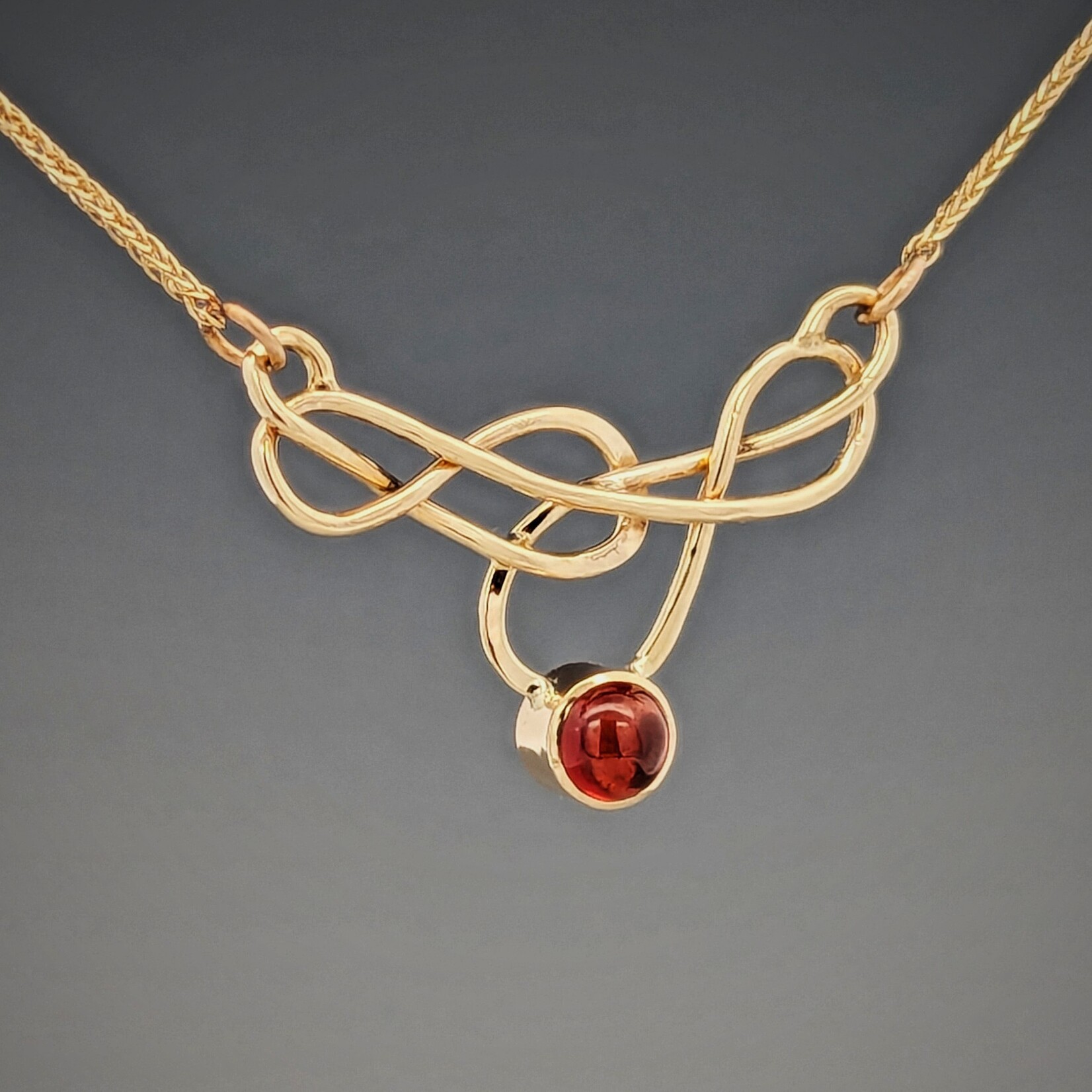 Modern Heirloom® Elegant Knot Necklace set with Garnet, 14k yellow gold