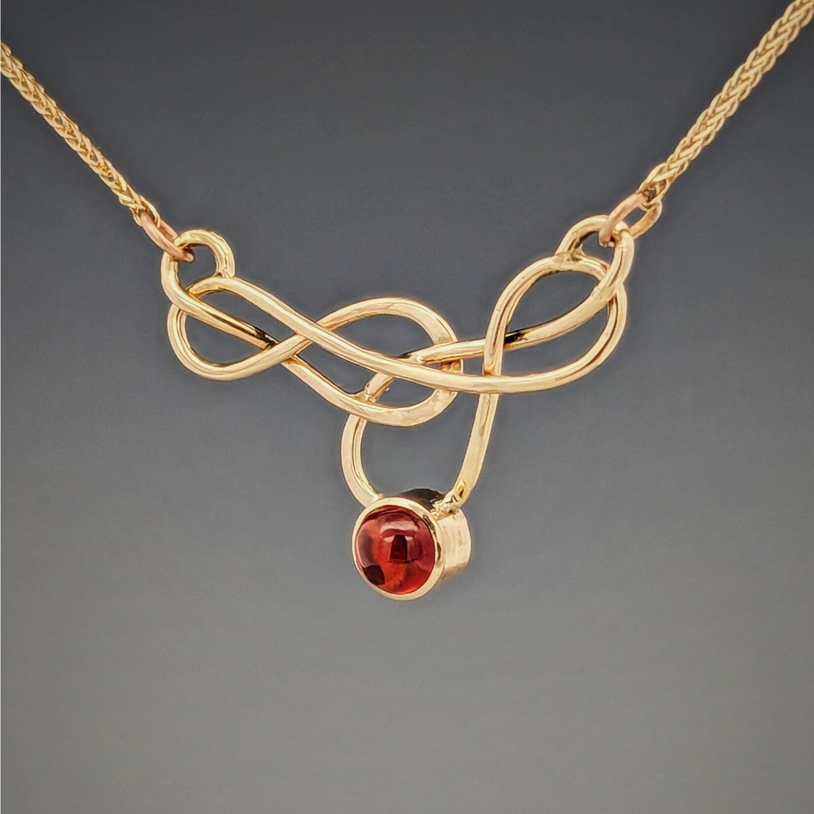 Modern Heirloom® Elegant Knot Necklace set with Garnet, 14k yellow gold