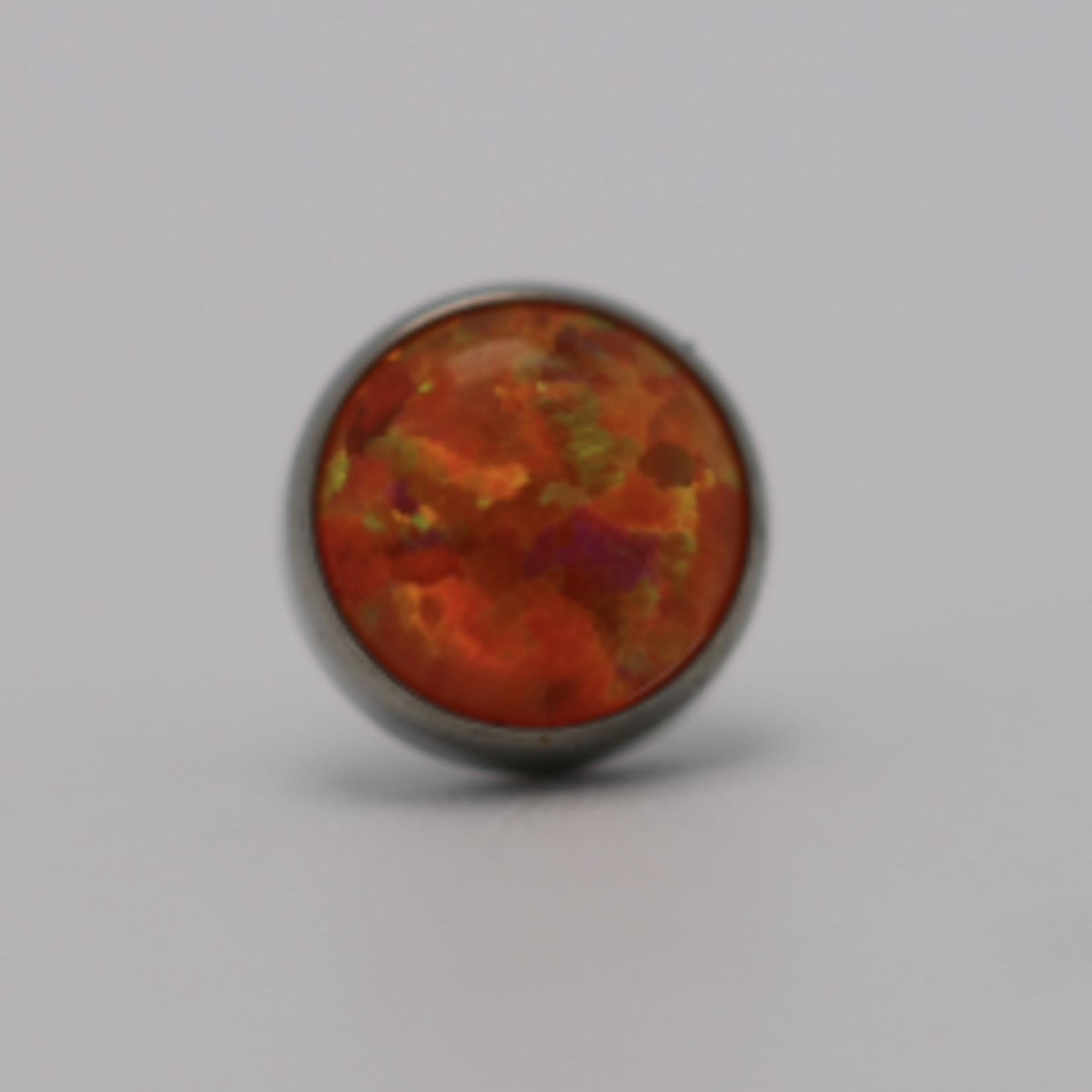 Neometal 18g cabochon bezel set 4mm synthetic orange opal