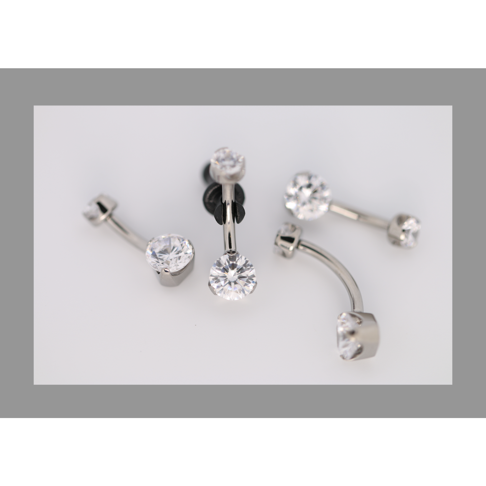 Anatometal 14g 5/16 brilliant cut round cz prong set navel curve