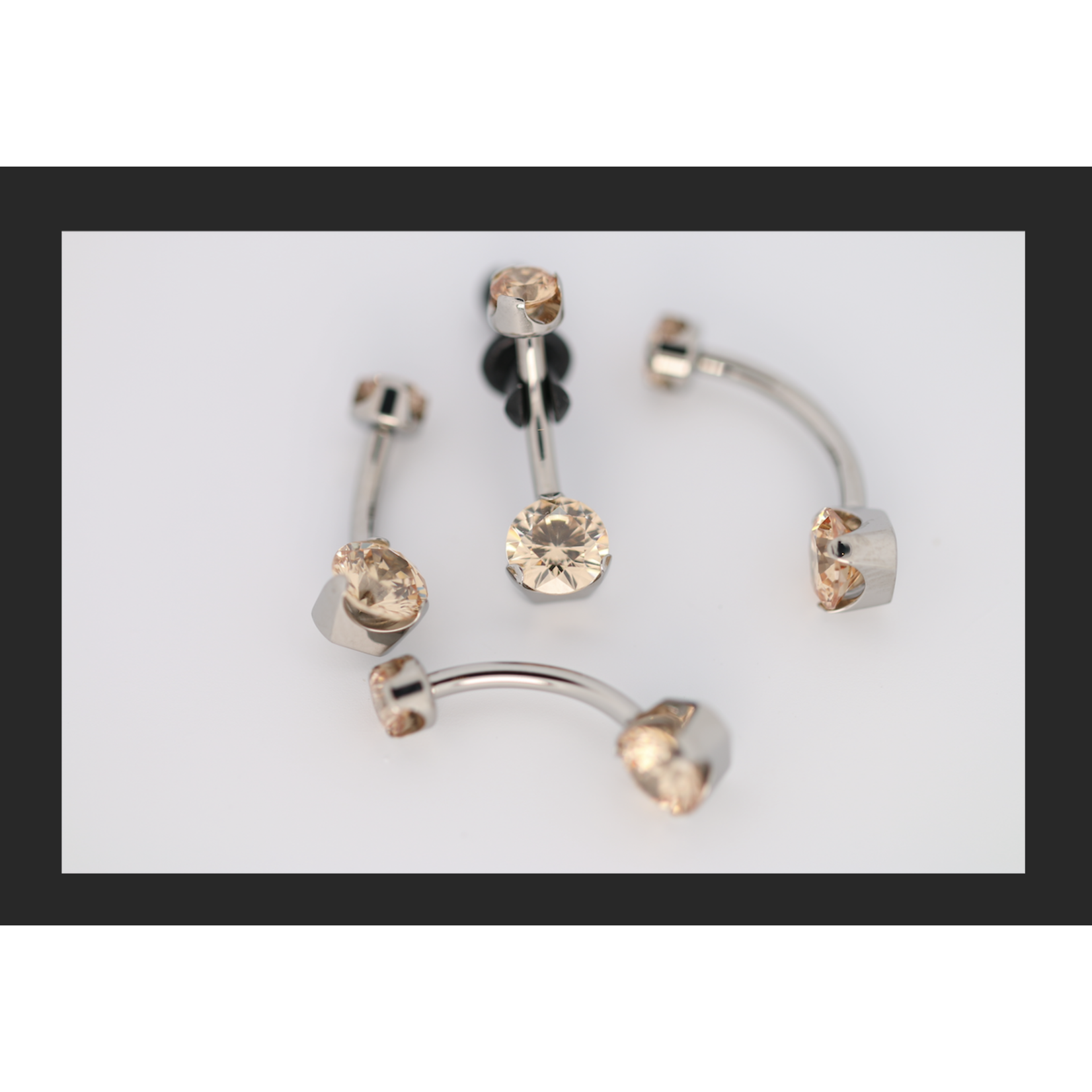 Anatometal 14g 1/4 brilliant cut round champagne prong set navel curve