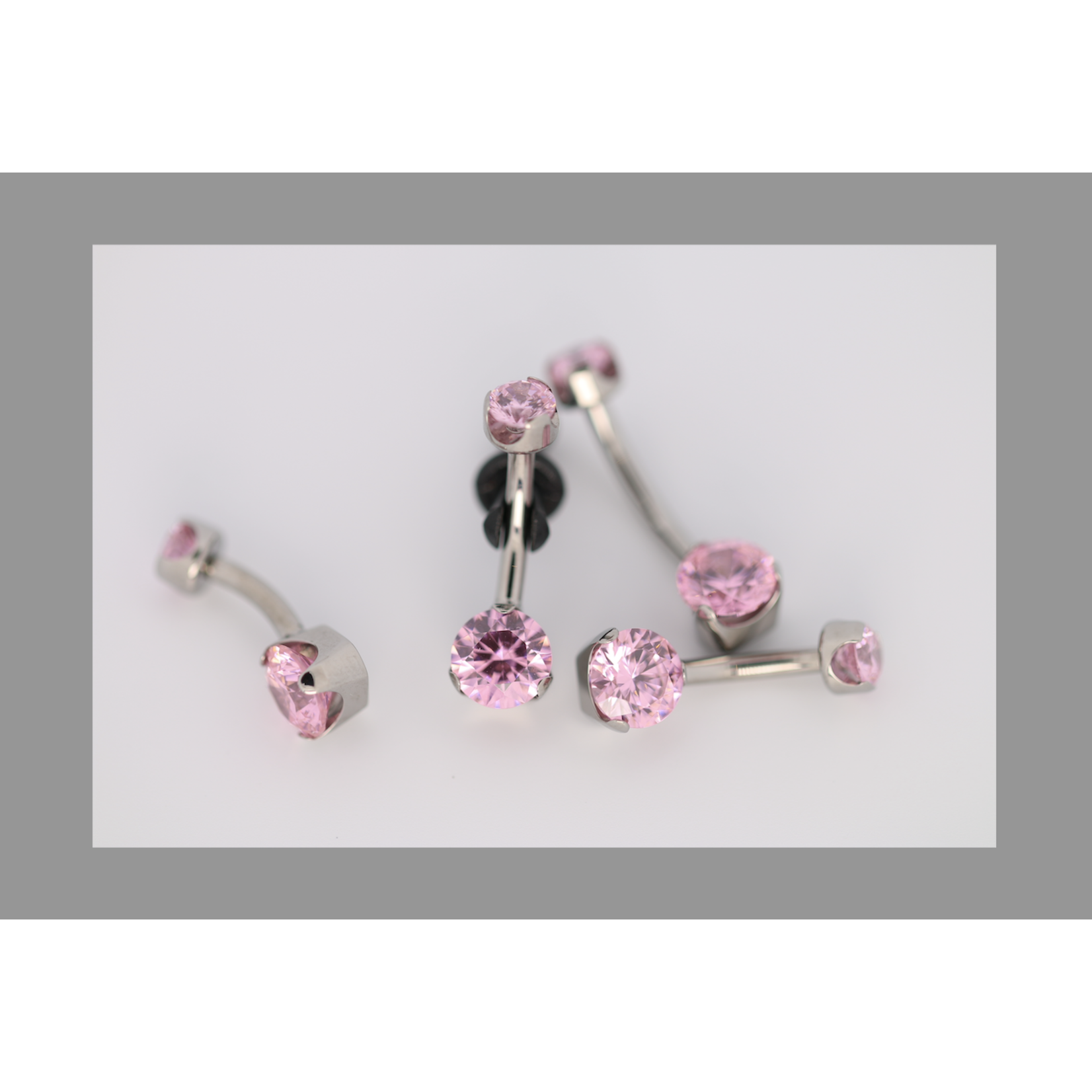 Anatometal 14g 3/8 brilliant cut round pink prong set navel curve