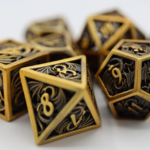 Foam Brain Games Dragon Essence Gold Hollow Metal Polyhedral 7 die set