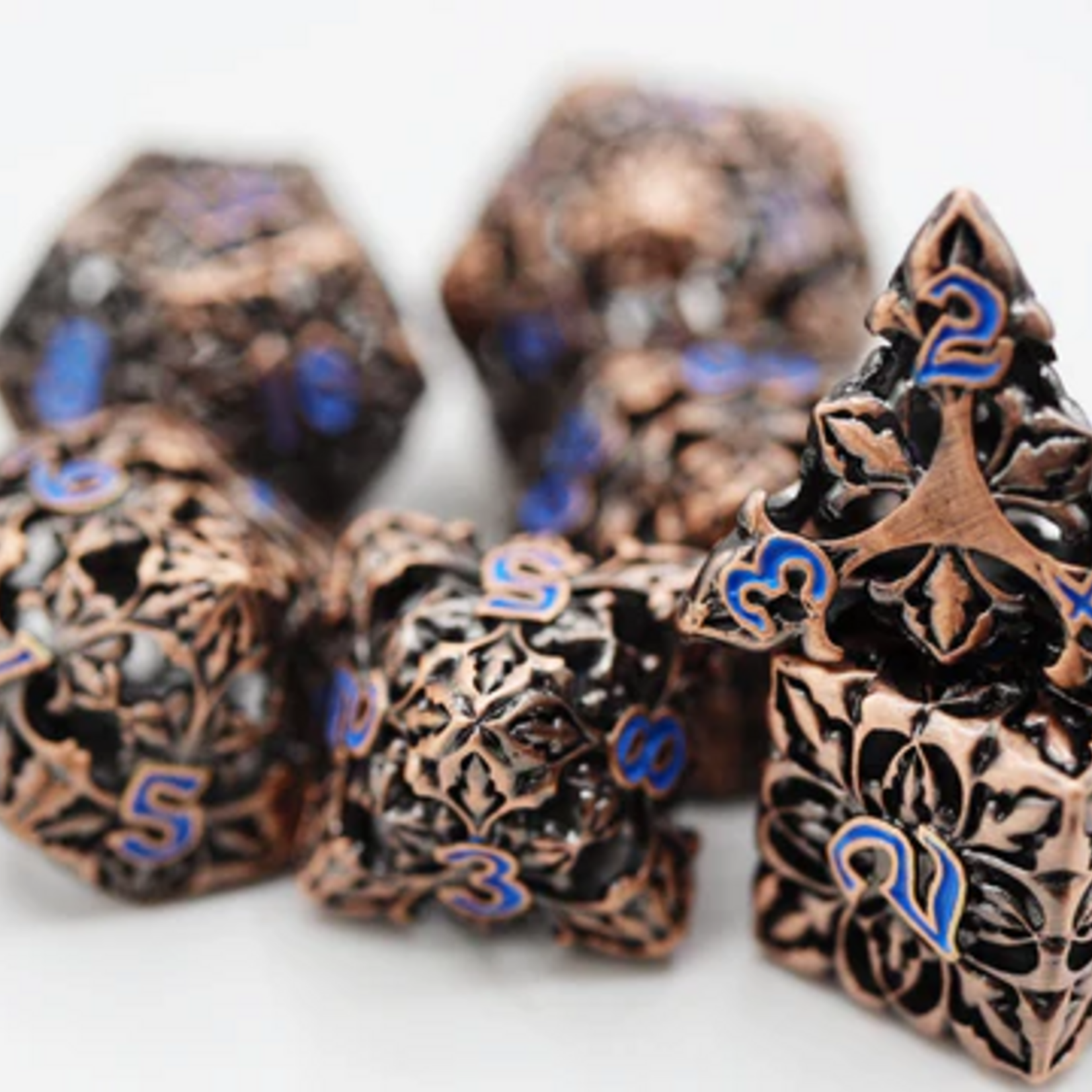 Foam Brain Games Fleur de Lis Copper Azul Hollow Metal RPG dice 7 die set