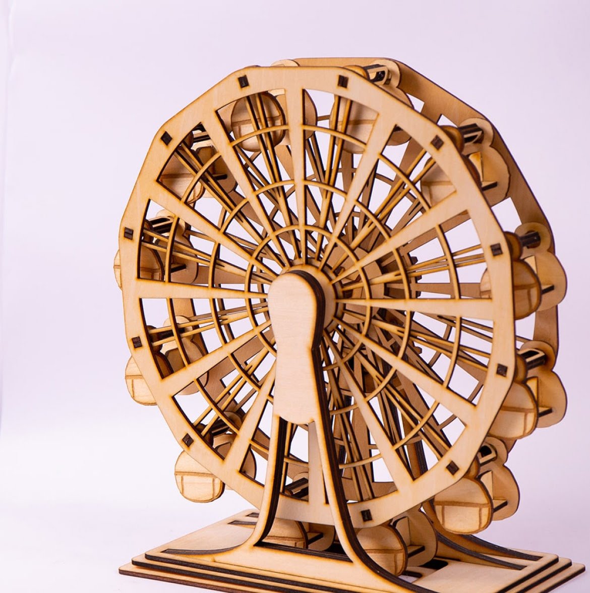 Wooden Ferris wheel model created with the FLUX Beamo laser cutter, featuring multiple cabins and a sturdy base.