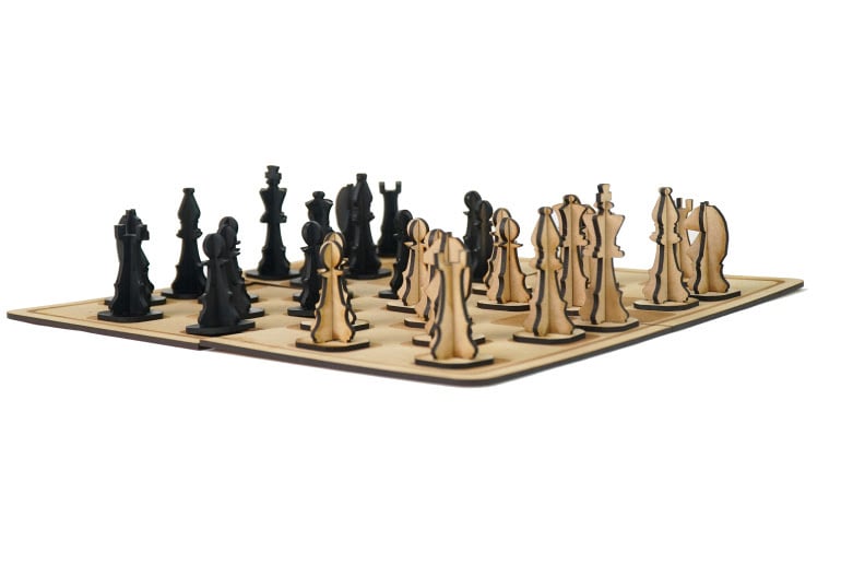 Engraved chessboard with chess pieces laser cut by FLUX Beambox Pro.