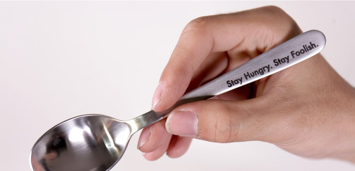 Spoon engraved by a FLUX Beambox Pro with the quote 'Stay Hungry. Stay Foolish' engraved on the handle.