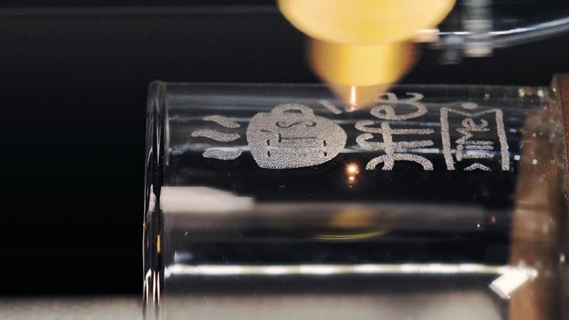 Glass being engraved with the rotary module