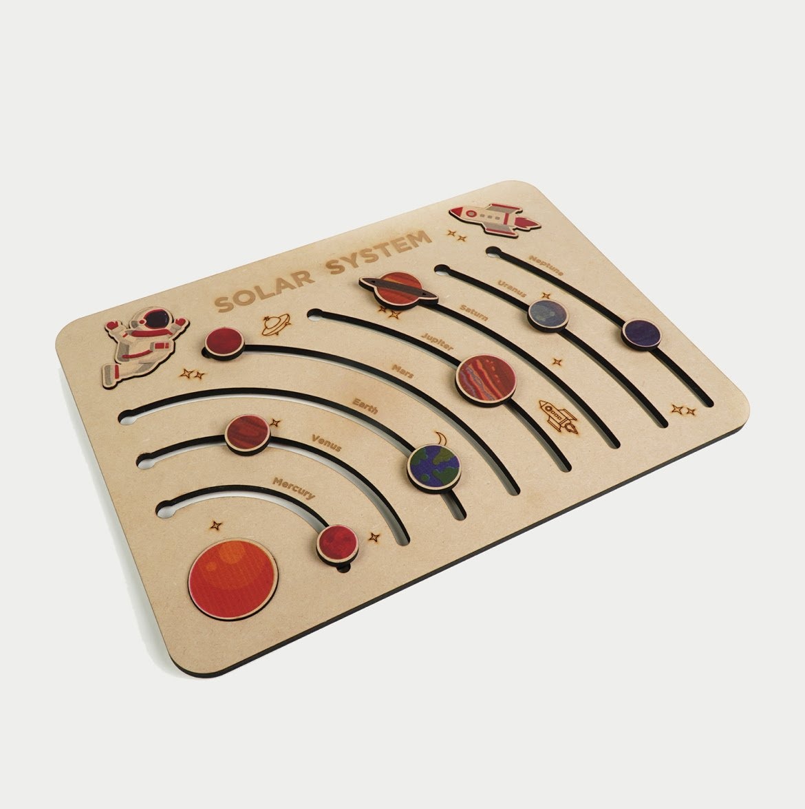 A wooden 2D version of the solar system and the planets and stars are cut and colour printed by the FLUX Ador.