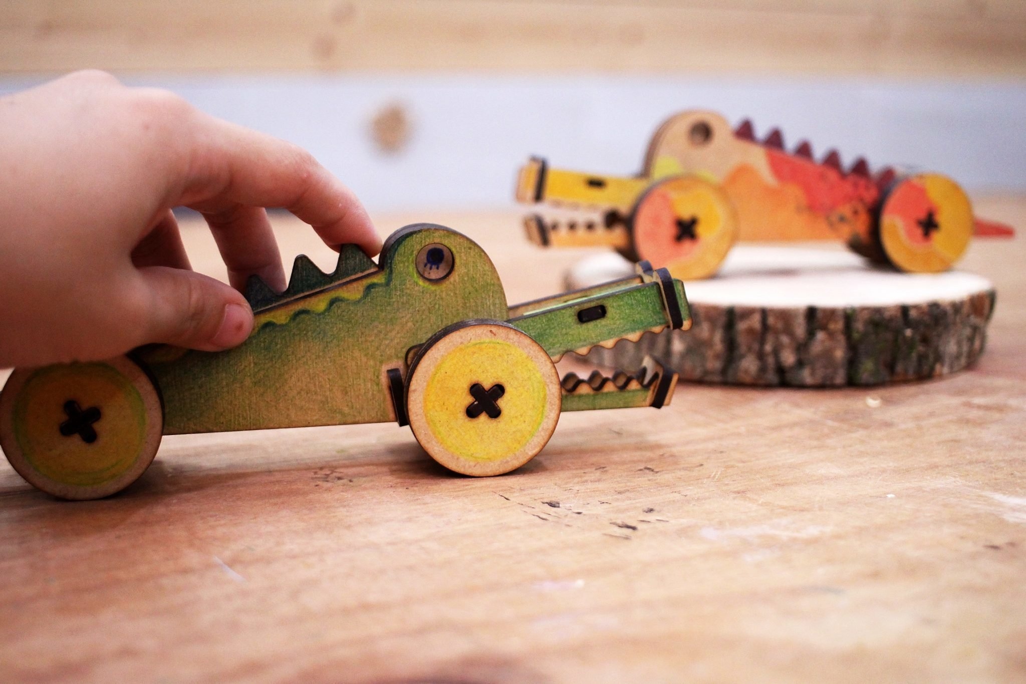 A wooden crocodile toy made with a FLUX laser cutter