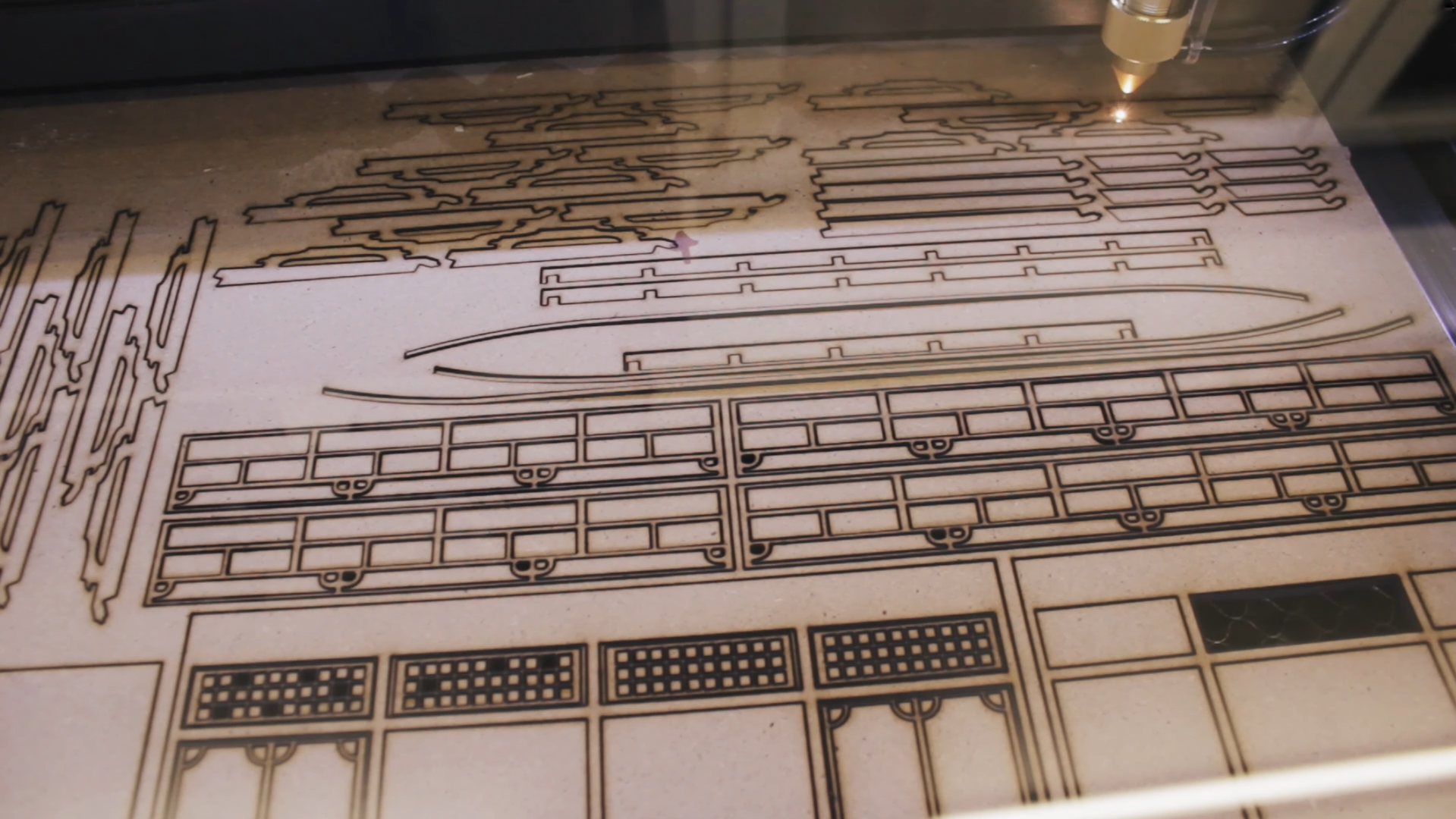 Laser cutting the parts of a model building