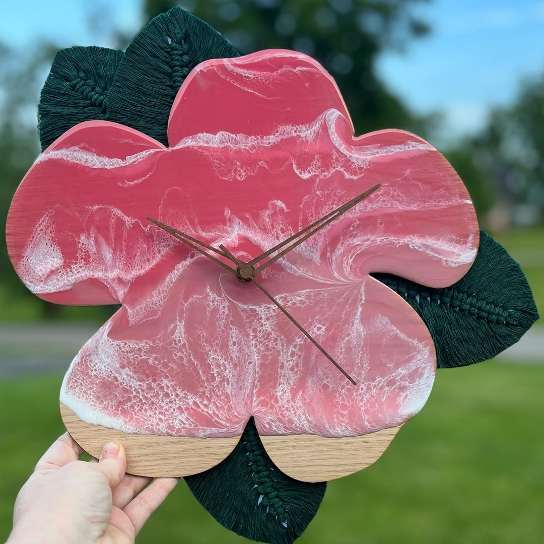 A wooden clock in the shape of a flower