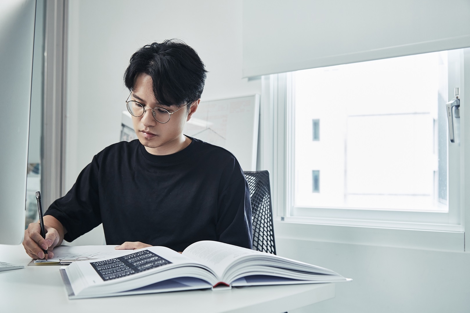 Leo working at his desk