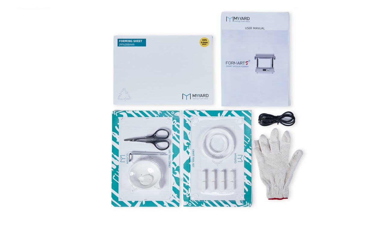 Knolled view of the MY YARD FORMART S box contents: GLoves, webbing remover kit, cat bowl molds, gloves, basic tool kit and 30 sheets of HIPS.