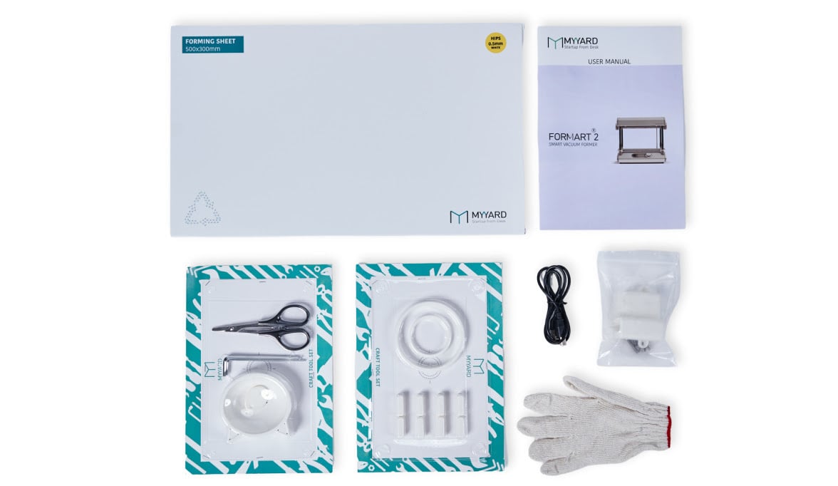 Knolled view of the MY YARD FORMART 2 box contents: GLoves, webbing remover kit, cat bowl molds, gloves, basic tool kit and 30 sheets of HIPS.