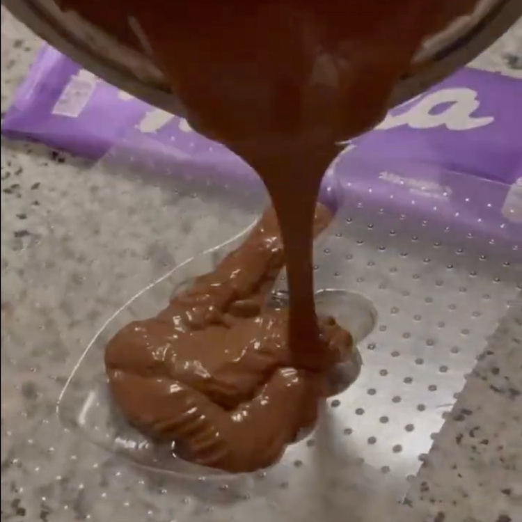 Pouring chocolate into the PET mold