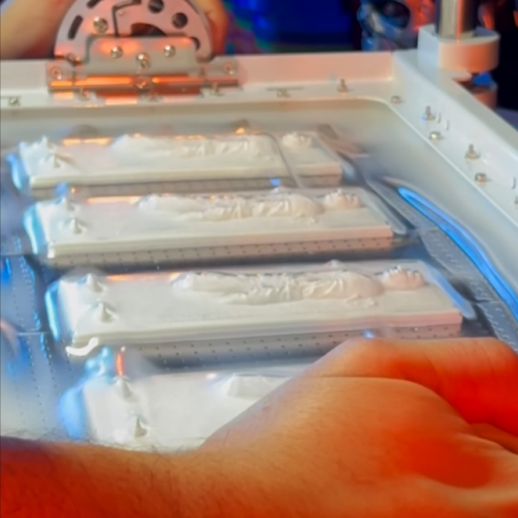 Vacuum forming a LDPE sheet over the carbonite prisons