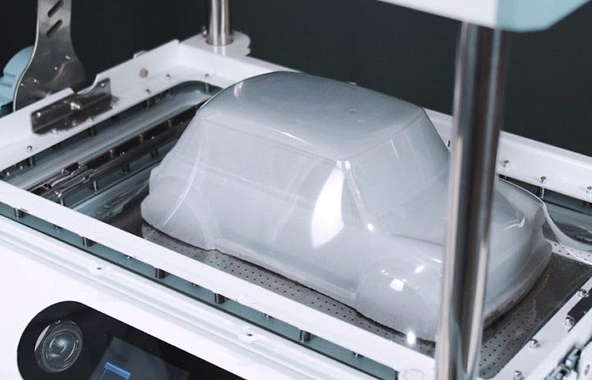FORMART 3 pulling the plastic sheet tight around the master mold.
