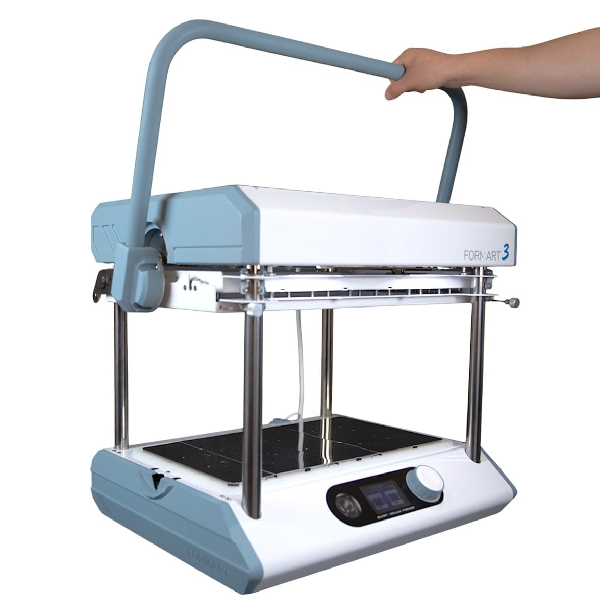 Hand pulling down the handle on the FORMART 3 vacuum former.