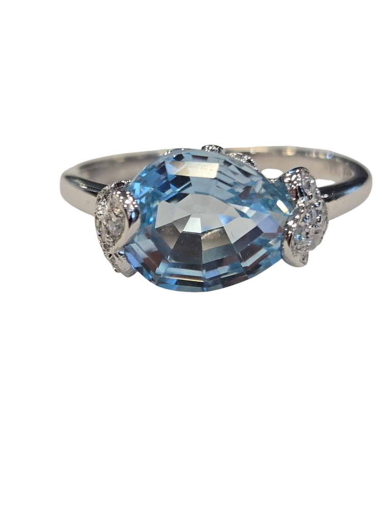 (R)14KW 2.69BT .11DIA WHITE GOLD BLUE TOPAZ AND DIAMOND RING