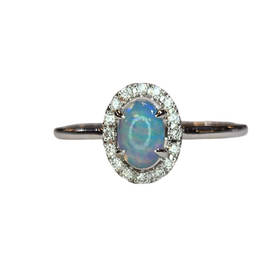 (X) 14KW .27OP .10DIA , WHITE GOLD OPAL RING WITH 16 ROUND DIAMONDS