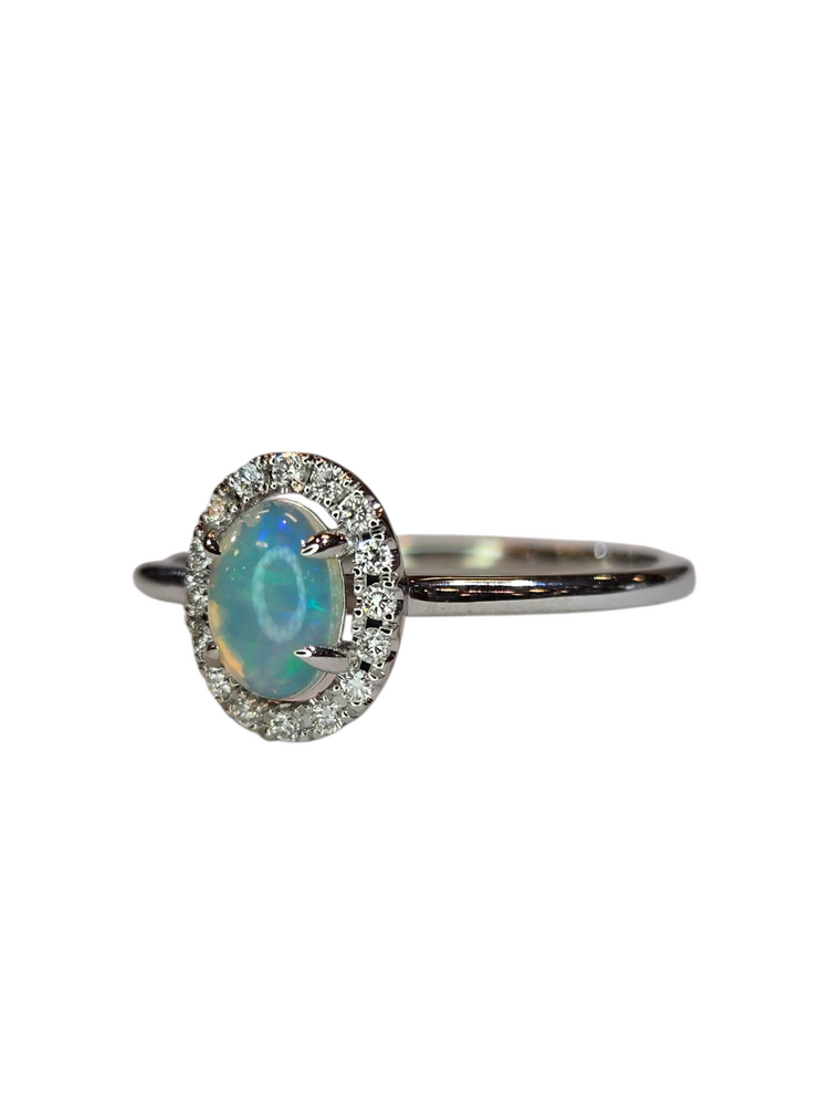 (X) 14KW .27OP .10DIA , WHITE GOLD OPAL RING WITH 16 ROUND DIAMONDS