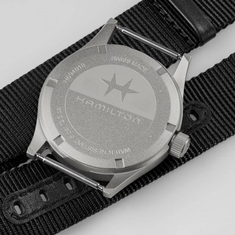 HAMILTON HAMILTON Reference H69401430 Caliber F06.105 Collection Khaki Field Movement Quartz Case size 38mm Thickness (mm) 8.3 Dial color Black Case material Stainless steel Crystal Sapphire Lug to lug 46mm Lug width 20mm