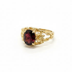 (Y)10KY 1.50CT GT OVAL CUT GARNET IN FLOWER BRAIDED BEAD RING