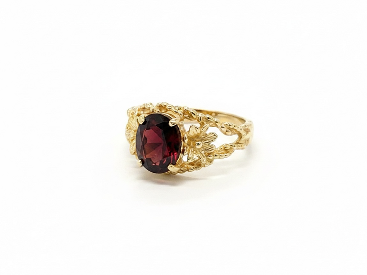 (Y)10KY 1.50CT GT OVAL CUT GARNET IN FLOWER BRAIDED BEAD RING