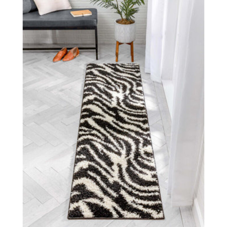 Dondre Animal Print Black Area Rug
