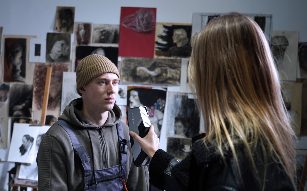 Woman scanning the face of a man