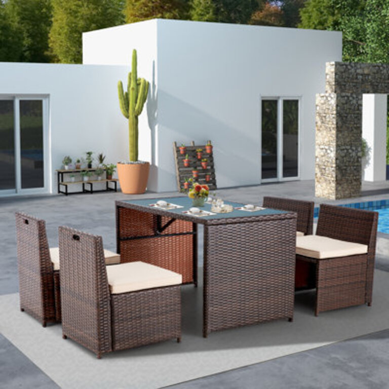 Yushin 4 - Person Wicker Patio Dining Set with Rectangular Table  Cushions Included