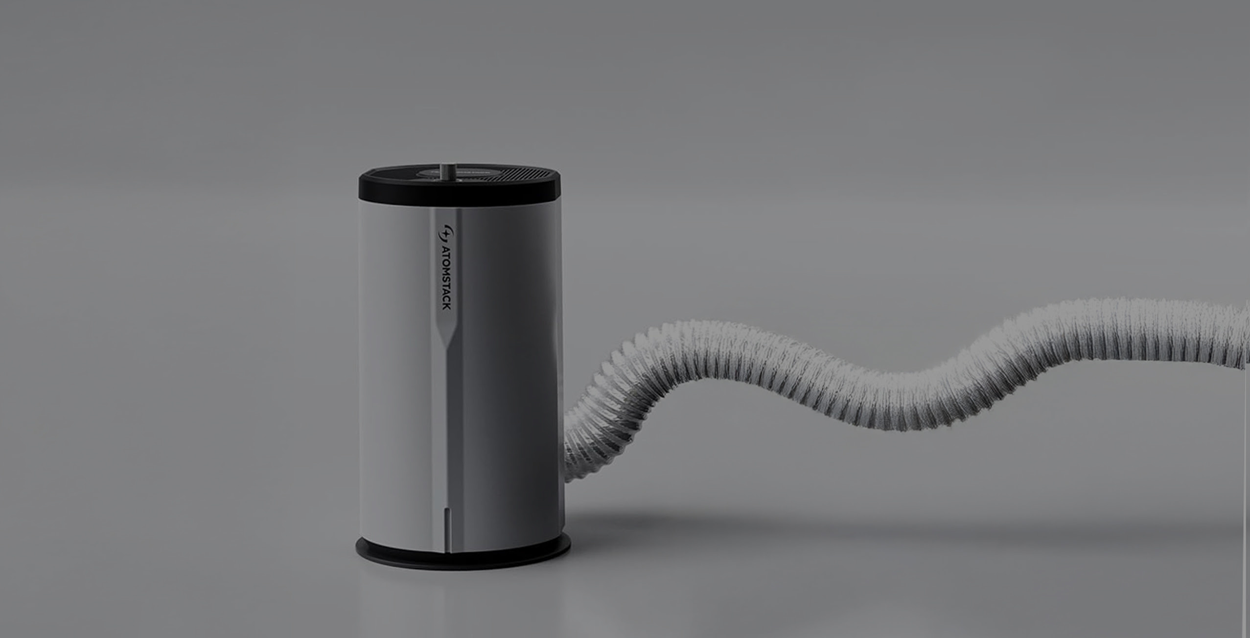 AtomStack D3 air purifier connected to a vent hose.