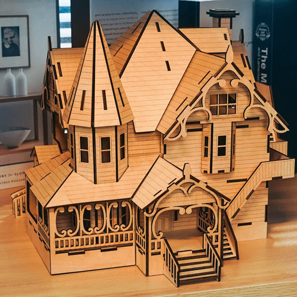 Lasercut gothic 3D building with spires made of plywood.