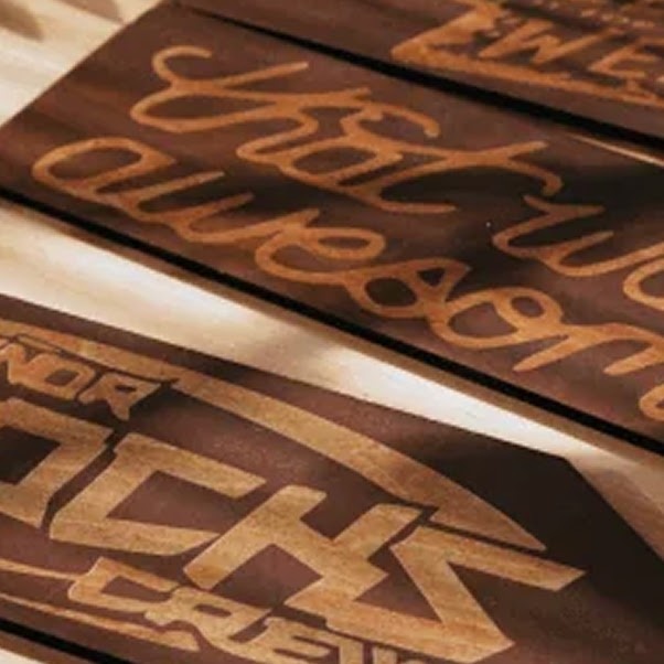 Wooden signs with laser engraved letters.