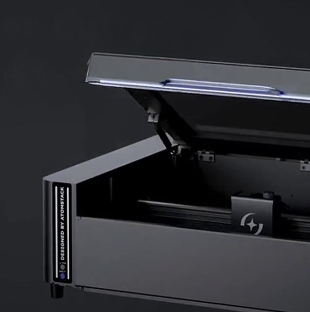 AtomStack Hurricane with the lid opened against a black background.