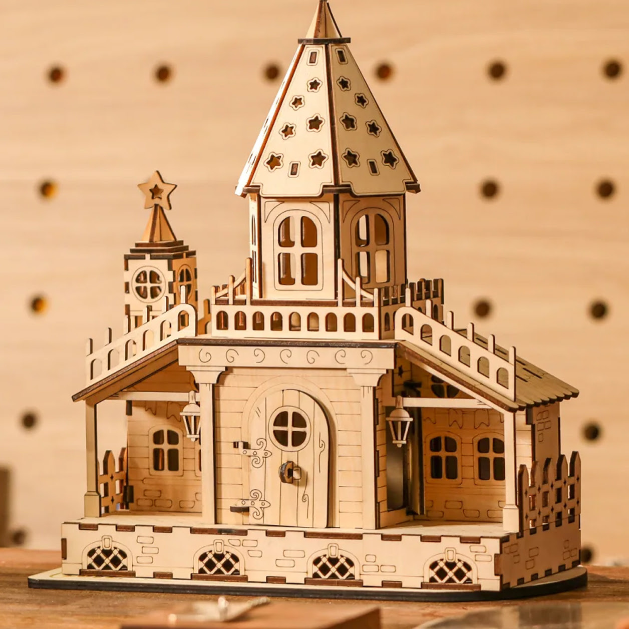 3D model of a lasercut wooden building with a spire.