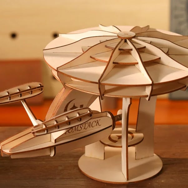 3D lasercut model of a wooden spaceship.