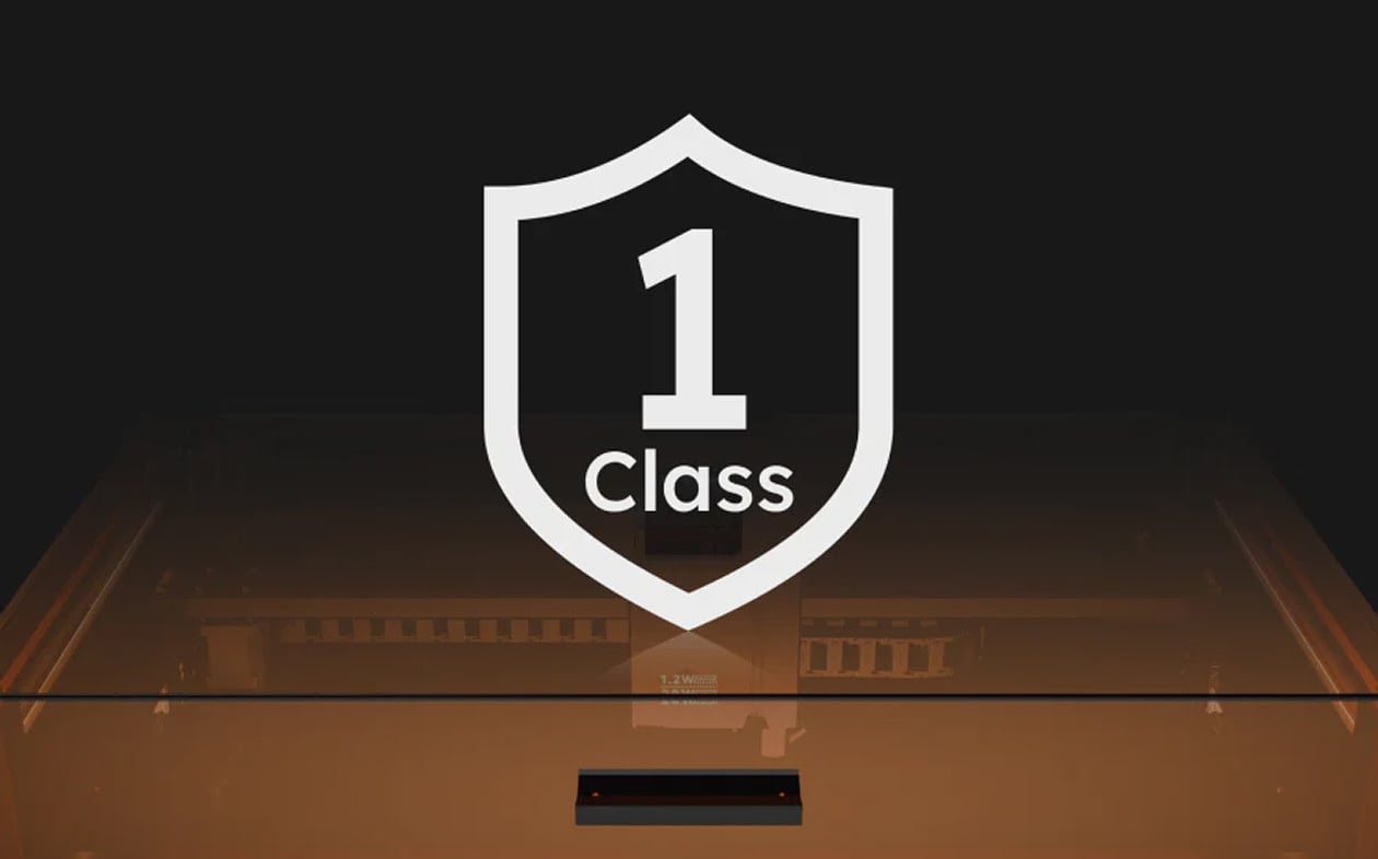 Frontal view of an AtomStack Kraft with the blue led strip glowing. On top is an illustration of a white shield and the text Class 1