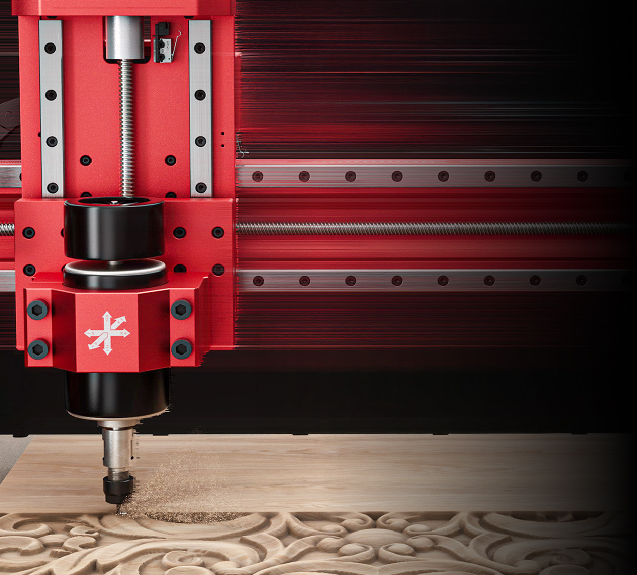 Close-up of an AtomStack C4 CNC spindle moving at speed carving an intricate pattern in wood.