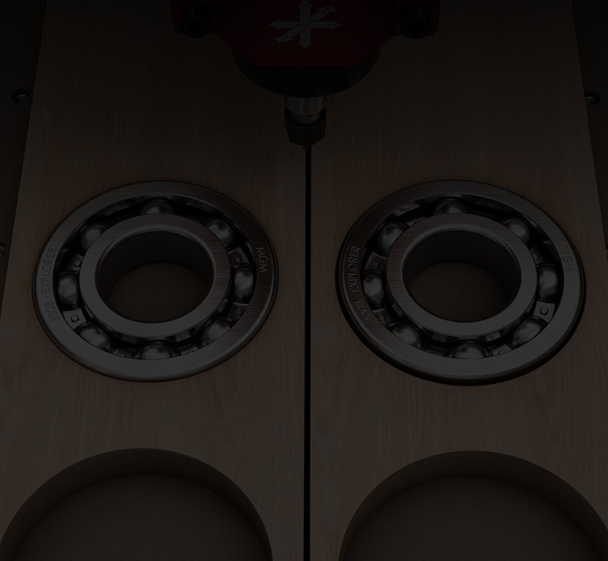 Piece of wood with two milled circles side by side. Each hole fits a ball bearing. Left it fits snugly, right there is some extra room left.