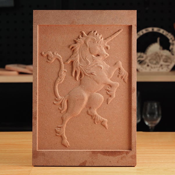 Rectangular piece of MDF with a milled design of a unicorn