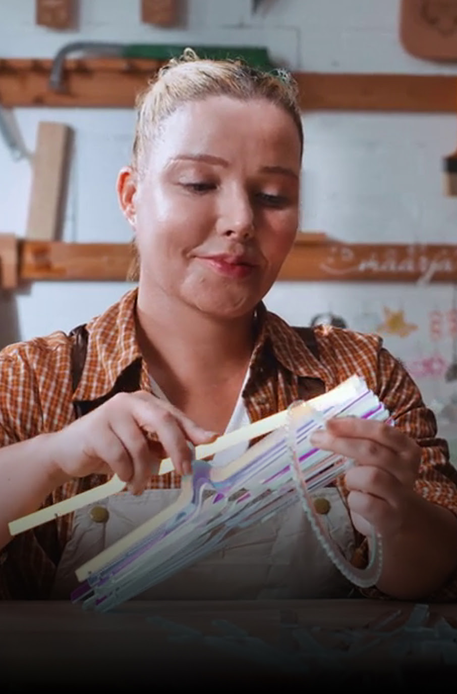 Woman assembling a lasercut chandelier
