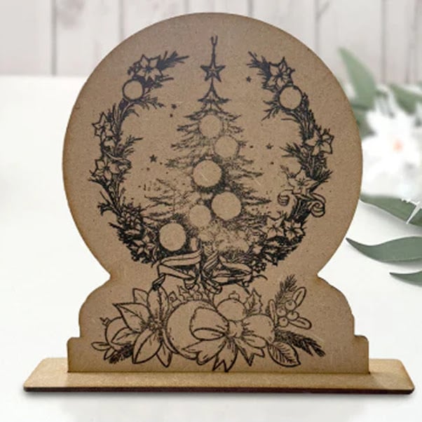 MDF lasercut 3D desk ornament of a christmas tree.