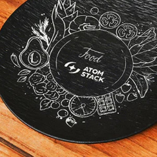 Slate plate with a lasercut engraving of food.