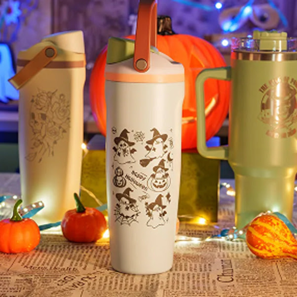 Engraved white tumbler with halloween designs.
