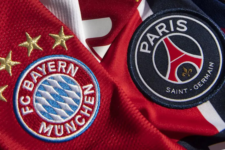 Close-up of high-density embroidered soccer crest patches for FC Bayern Munich and Paris Saint-Germain on sports jerseys